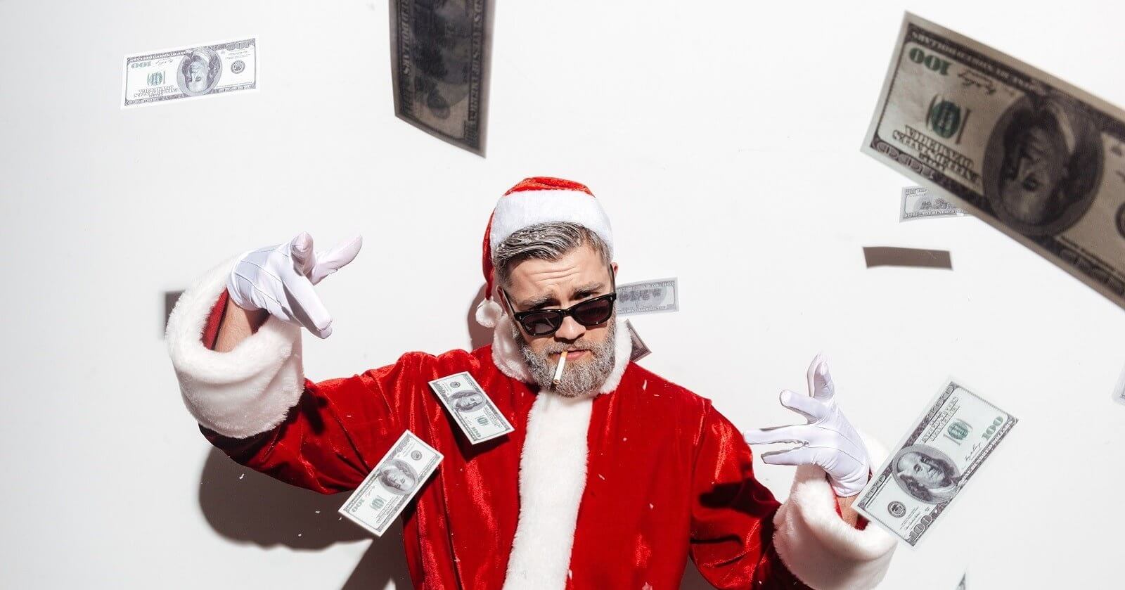 Weihnachtsmann wirft Geldscheine